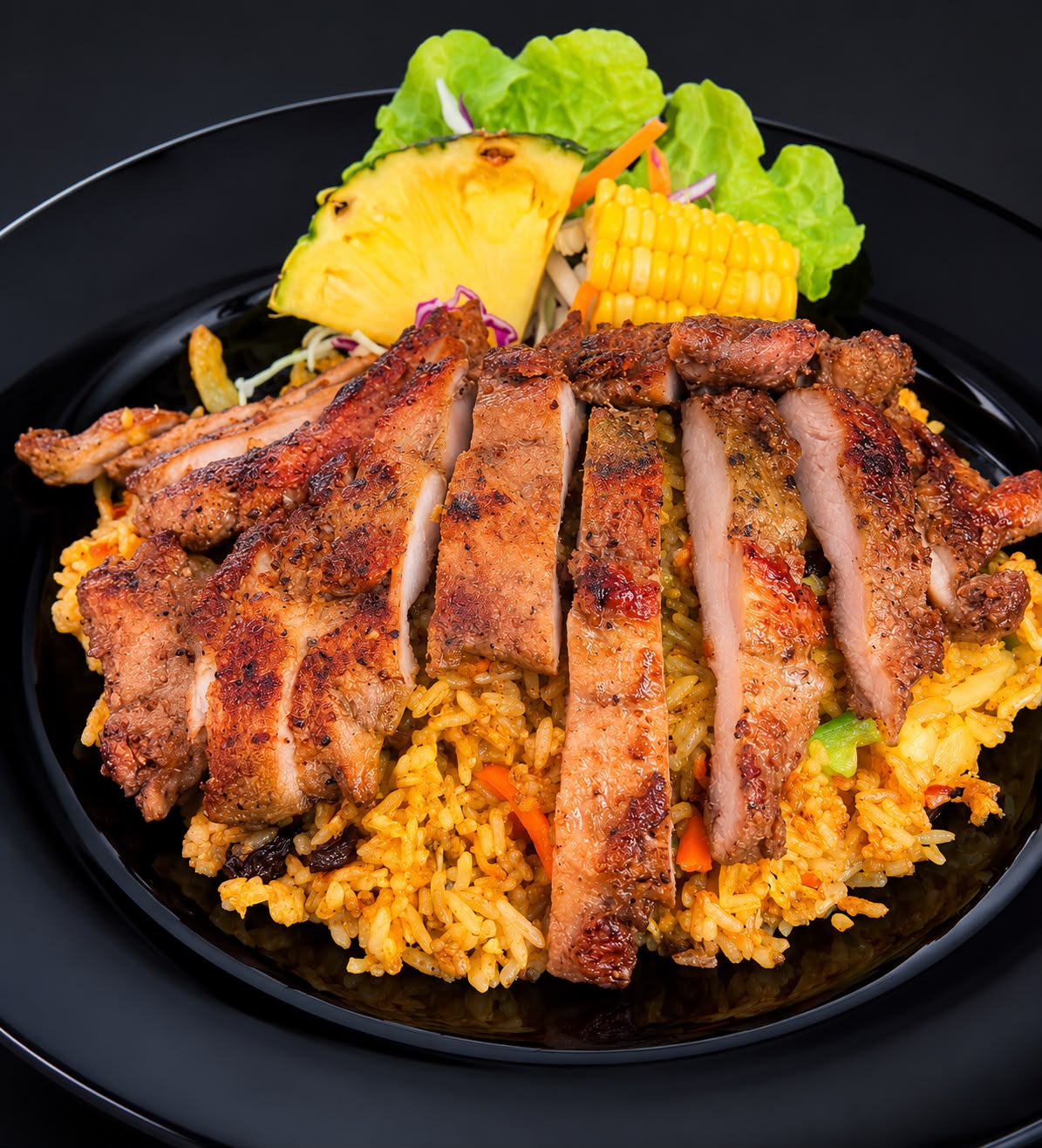 Sliced jerk chicken over spiced yellow rice